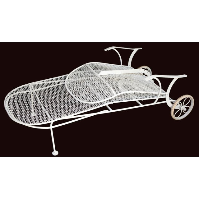 A Classic Mid Century Modern, Russell Woodard Iron Mesh Body Adjustable Back Chaise Lounge on Wheels, 1960s.Unmarked....