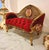 Make a bold statement with this French Rococo-inspired sofa, beautifully upholstered in rich red velvet with deep button...