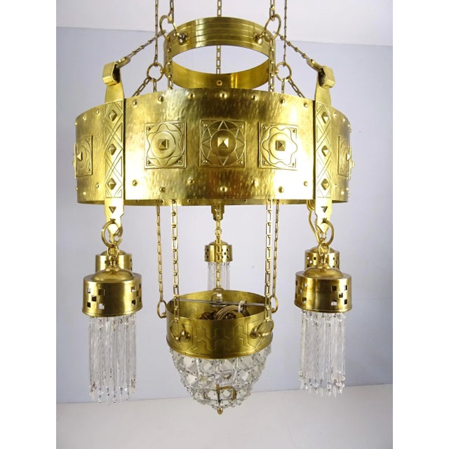 X-Large chandelier made of solid brass and blown and cut glass. 5 light sources on the outer ring and one light source...