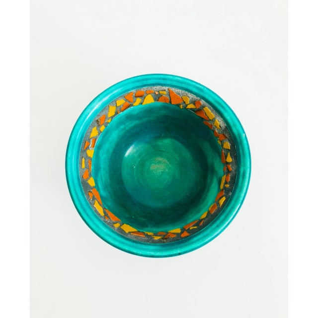 A sweet vintage handmade pottery bowl. Perfect for display or using as a catch all. Bright blue-green glaze with unique...