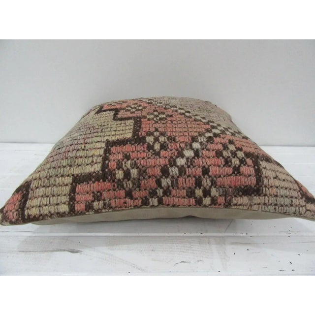 This is a pillow cover made from a vintage kilim rug. The piece was properly washed and ready to use. Pillow inserts not...