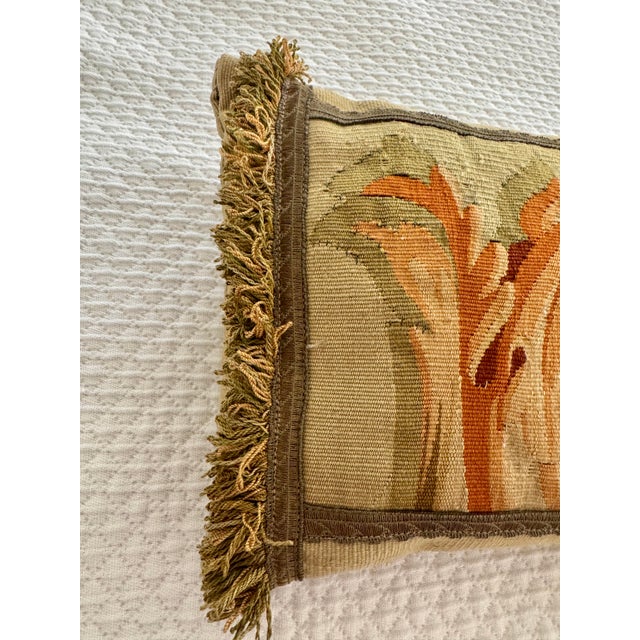 Listing is for a 19th century Aubusson panel that has been mounted to woven beige fabric with passementerie fringe trim in...