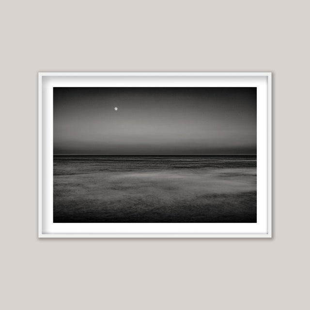 Moonrise IV, Selsey (BW) - a long-exposure, black and white photograph capturing twilight’s quiet transformation as the...