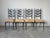 A striking set of six vintage high-back dining chairs from the 1970s, inspired by the iconic style of Italian designer Gio...