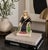 A very good antique Staffordshire flatback figure depicting Queen Victoria seated in a high-back chair, wearing a crown...