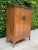 Stunning Chinese Wedding Cabinet circa 1800. This is a gorgeous antique Chinese storage piece from the Qing Dynasty,...