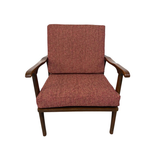 An exceptional Mid-Century Modern Walnut Arm Chair, beautifully reupholstered and showcasing timeless American modernist...