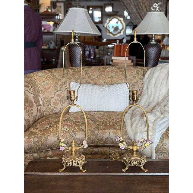 Stunning pair of Brass and Glazed Ceramic Louis XV Style Table lamps. Note the lovely floral detail in hues of pink,...