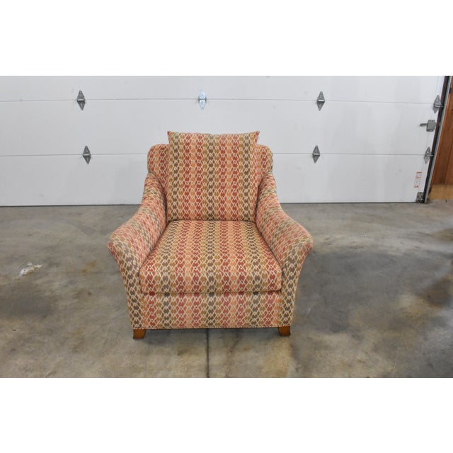 Very nice striped diamond pattern lounge chair with pillow made by Century Furniture Company. Red, tan, orange, brown, and...