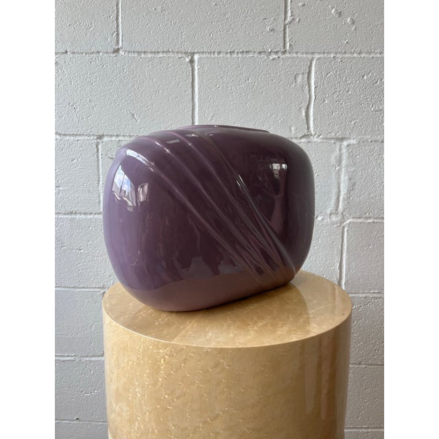 A striking Postmodern ceramic vase by Jenkins Ceramics, executed in a rich aubergine glaze. The vessel features a softly...