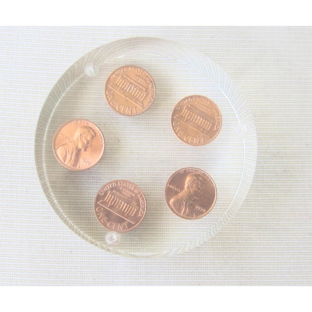 all pennies are marked 1970. has 4 tiny feet on bottom.