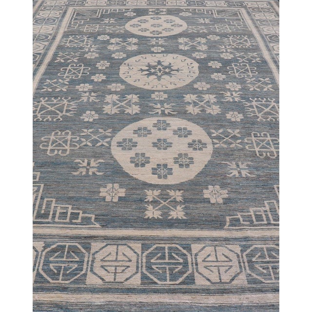Modern Khotan long rug with circular medallions in shades of steel blue & off white. Keivan Woven Arts rug AFG-58337,...