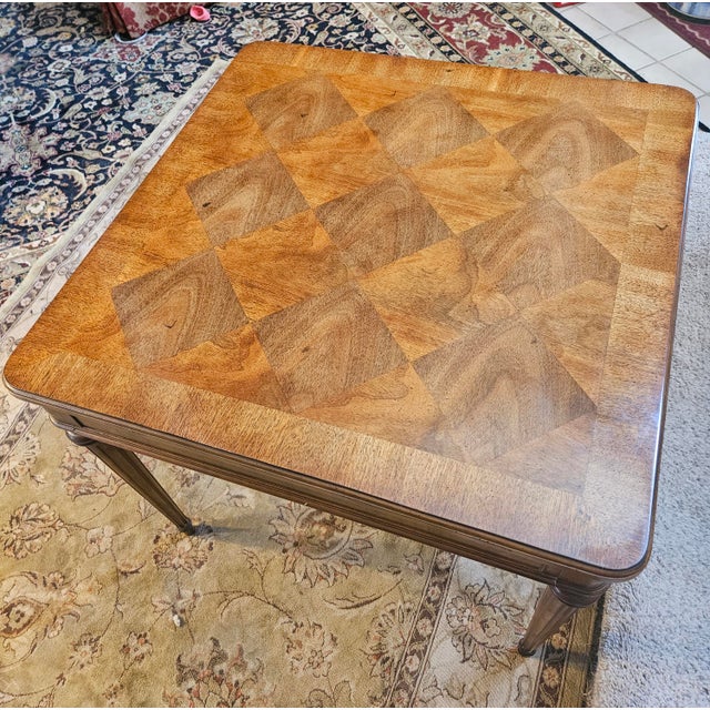 Beautiful workmanship shows on this fluted leg side table. The top has an inlaid and matched diamond pattern.