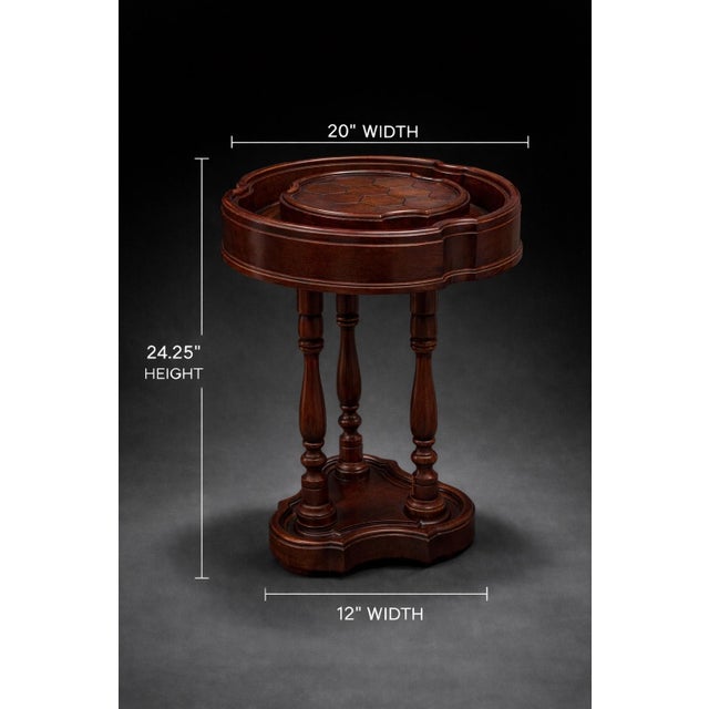 A wonderfully sculptural vintage gentleman’s smoking table featuring a gallery tray top, raised central platform, and...