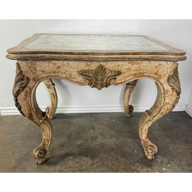 An exquisite antique European coffee table crafted in carved giltwood, dating to the early 20th century, circa 1910–1930....