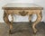 An exquisite antique European coffee table crafted in carved giltwood, dating to the early 20th century, circa 1910–1930....