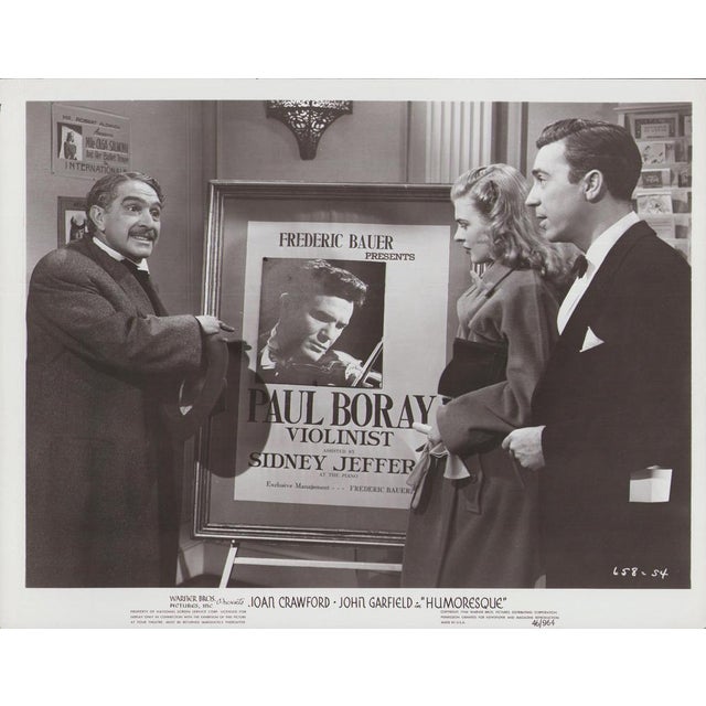 Original black-and-white lobby card for the film "Humoresque" (1946) featuring Joan Crawford, John Garfield, and J. Carrol...