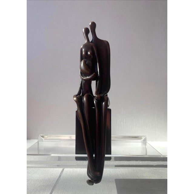 A cabinet-sized abstract bronze sculpture by listed artist Sami Ben Lulu, titled "Protection". Two stylized, intertwined...
