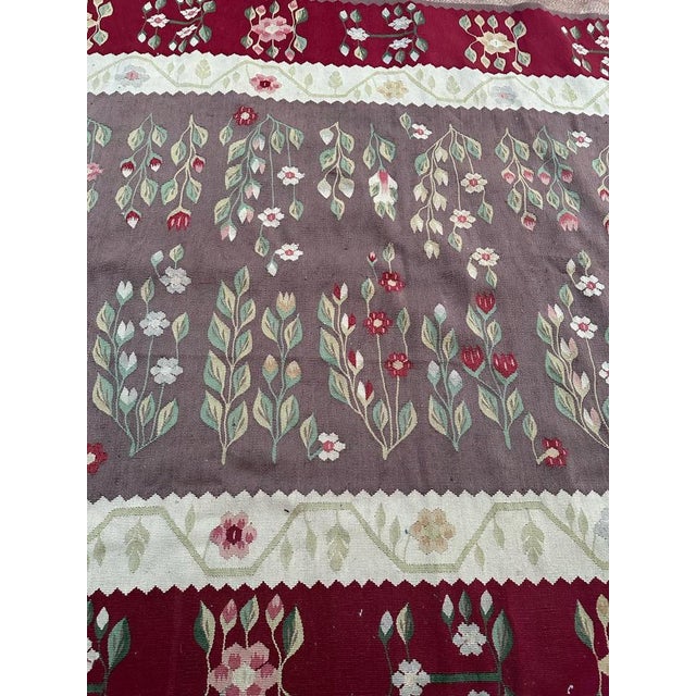 Discover the timeless beauty of this mid-20th-century Kilim rug, meticulously handwoven in wool on cotton. Adorned with...