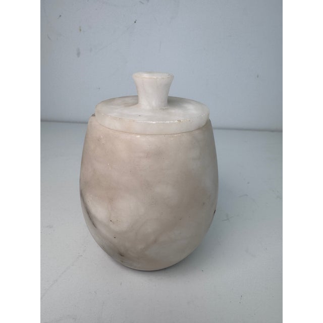 This jar has a nice time worn feel yet it still has a modern look. There is nice marbling and color variation.