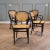 This set of 4 Thonet no. 215 RF (coffee house) chairs was manufactured 1980 (as marked underneath the seat). The chair was...