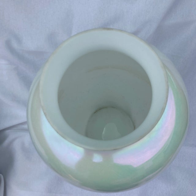 This 13 inch tall iridescent glass vase is in good condition with a few stains around the top edge . Made by American...