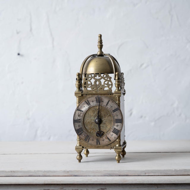 Brass lantern clock signed Chas. Frodsham, Clockmaker to H.M. The Queen. 4 inches wide by 3 ⅝ inches deep by 10 3/8 inches...