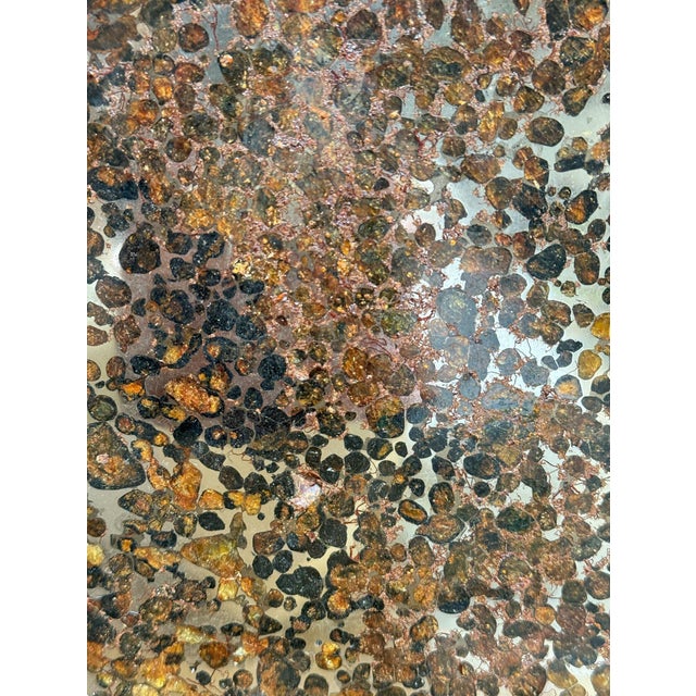 An extraordinary pallasite meteorite slice from the Jericho Strewn Field, Kenya, beautifully displayed on a custom black...
