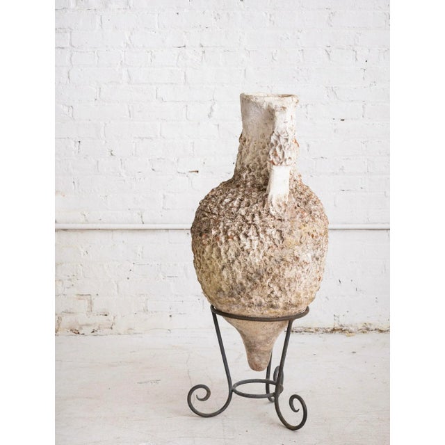 Antique Italian vessel on iron stand. Terra cotta earthenware with a matte white finish. Heavily textured surface with...