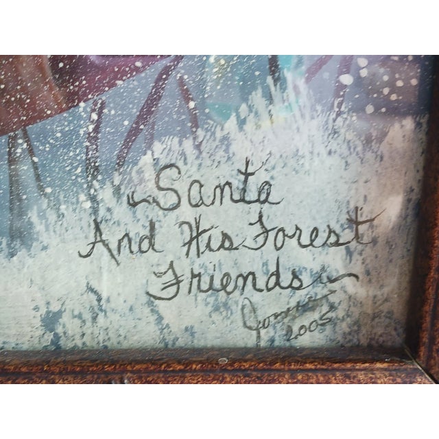 "Santa in snowy woods with his forest friends." Titled lower right with hard to read artist name and date of 2005....