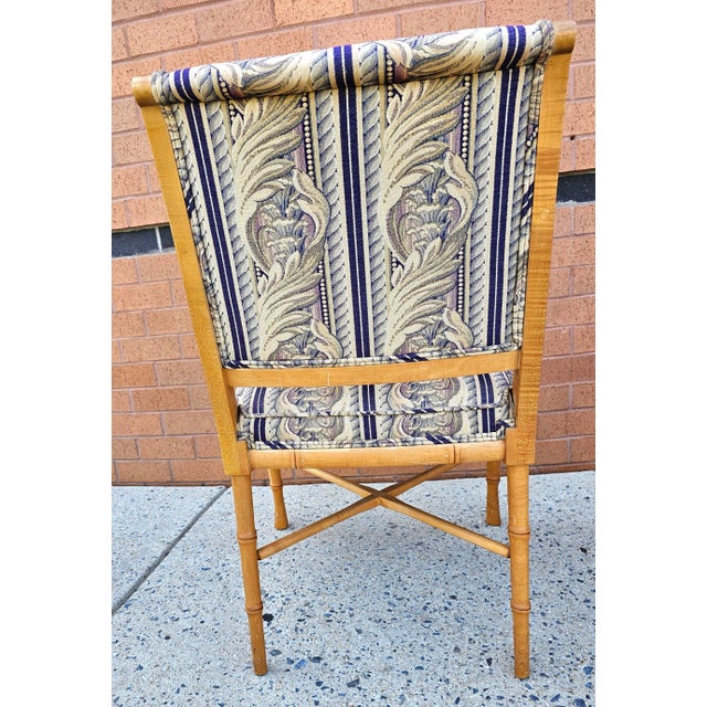 An exquisite pair of faux bamboo maple and tapestry upholstery arm chairs. Very good vintage condition. Measures 23" in...