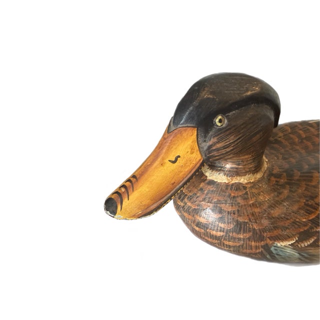 So much incredible detail on this mallard decoy! Hand-carved and hand-painted with some vintage wear, this will absolutely...