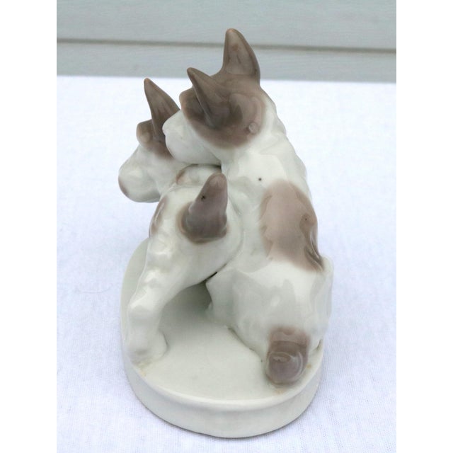 Adorable Japanese porcelain terrier figurine of 2 dogs playing. I love the creamy grayish tan spots on the dogs. Classic...