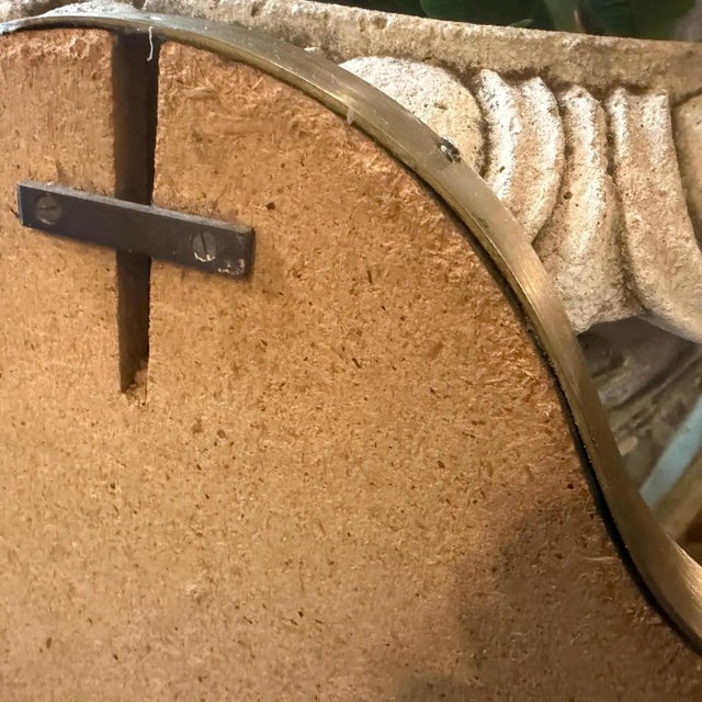 This exquisite mid-century modern wall mirror captures the sophisticated elegance of 1950s Italian design, closely...