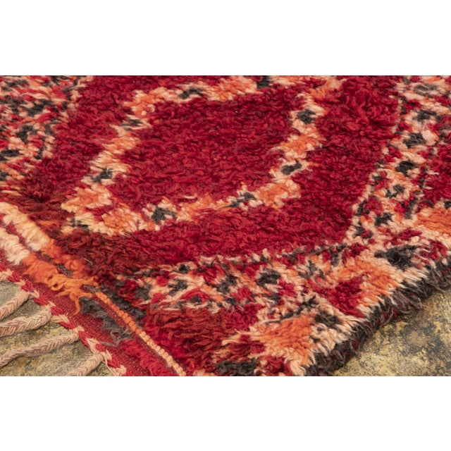 Hand-knotted in wool and originating circa 1950-1959, this 7x13 vintage Moroccan berber rug joins Rug & Kilim’s Moroccan...