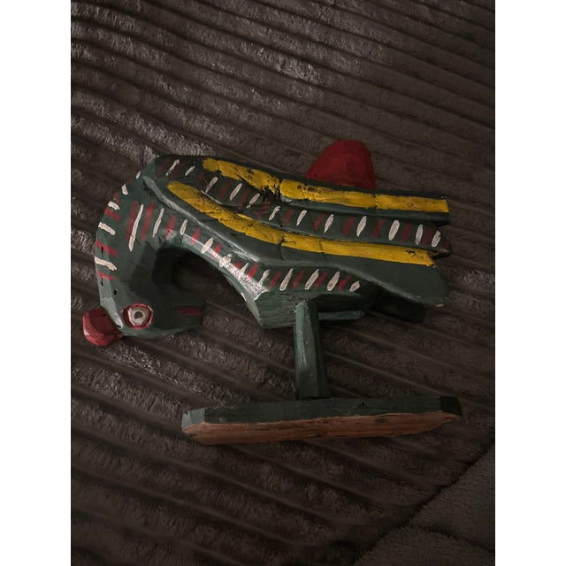 Bring vibrant cultural depth and rustic charm to your home with this delightful, hand-carved and hand-painted wooden...