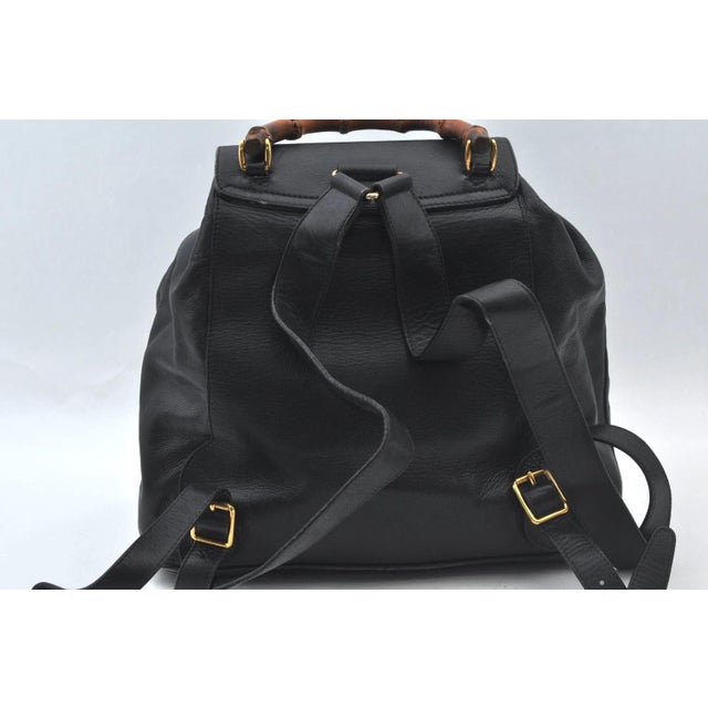 Vintage GUCCI Bamboo Black Leather Backpack with Certificate of Authenticity. Inside zippered compartment and two outside...