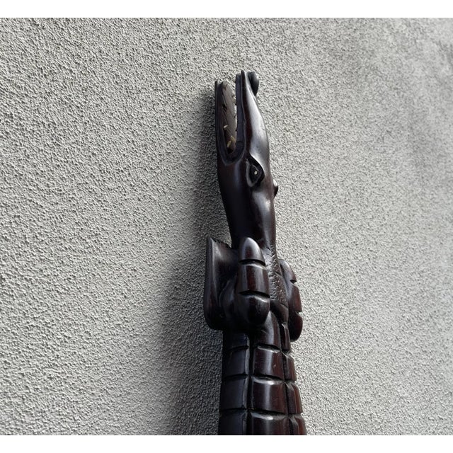 85 cm long crocodile in hand-carved wood. Brought home from Africa during the 1970s by a Danish Tourist. It has a screw to...