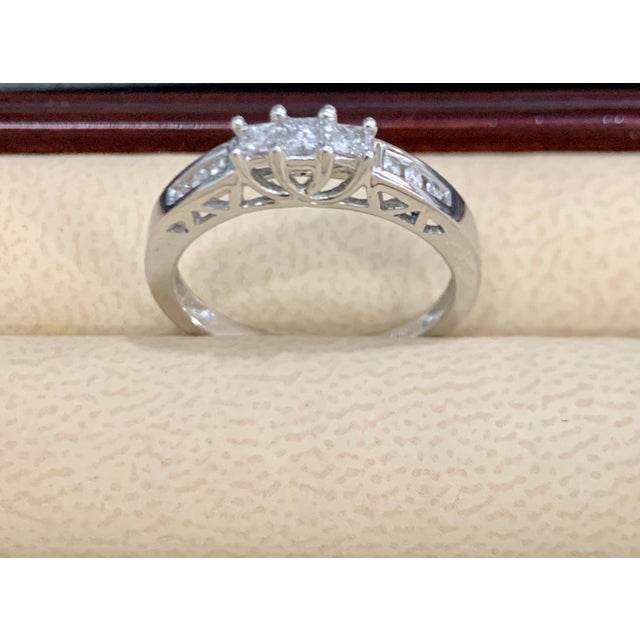 Three Stone Diamond Traditional Ring/Band 14 Karat White Gold Three Princess cut diamonds next to each other followed by...