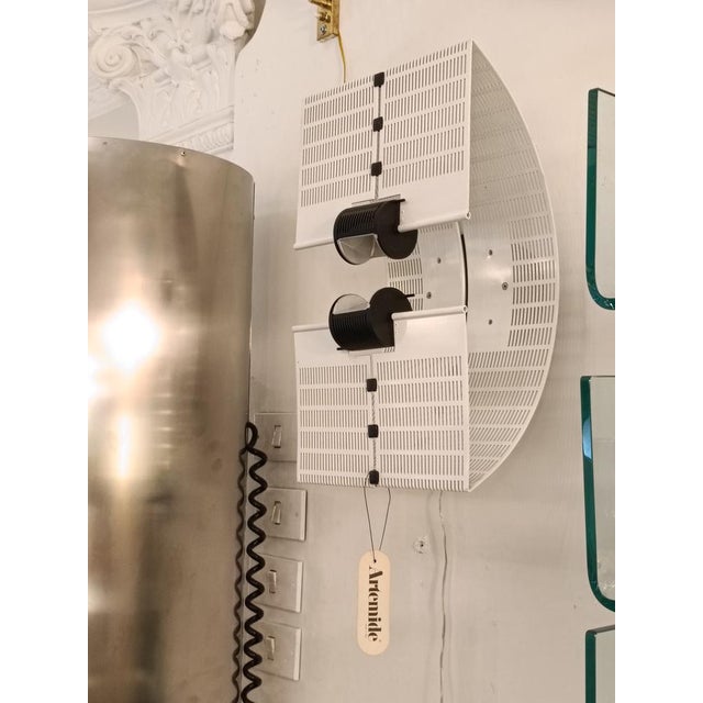 An extremely rare wall lamp, model ‘Fidia’, by Mario Botta. Designed and manufactured in Italy in 1985. White powder-...