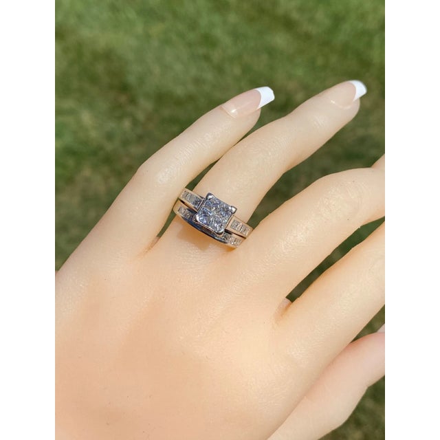 The Tiger: Infinity Set Princess Cut Diamond Engagement Ring in White Gold. The ring features four infinity set princess...