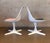 These are a pair of authentic Burke molded fiberglass chairs and a matching round pedestal table, all beautifully...