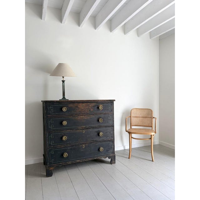 A regency chest of drawers, constructed in timber and overpainted in soft black. This early 19th century ebonised dresser...