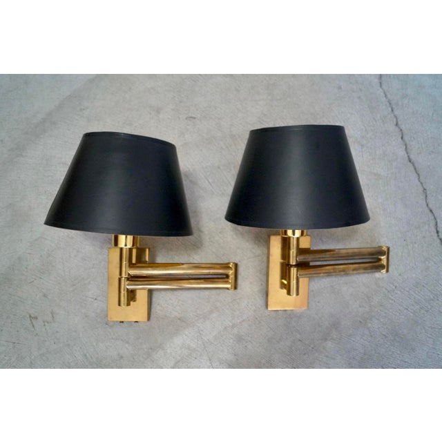 Pair of original vintage Mid century Modern sconces for sale. These are well made, and made of solid brass. They have a...