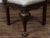 An English oak corner chair from the 19th century, with carved foliage, mascaron motifs and new upholstery. Created in...
