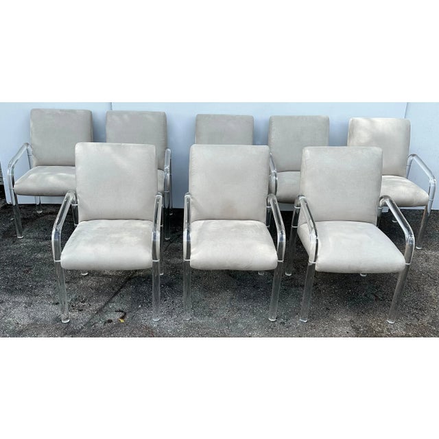 Set of 8 Lucite signed Lion in Frost Armchairs. Newly reupholstered in beige ultra suede.