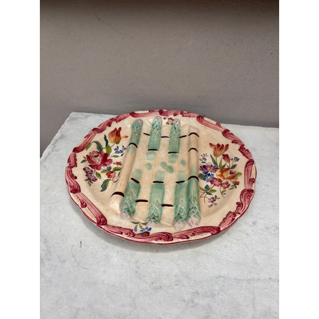 Majolica asparagus plate with flowers , signed Longchamp circa 1890.