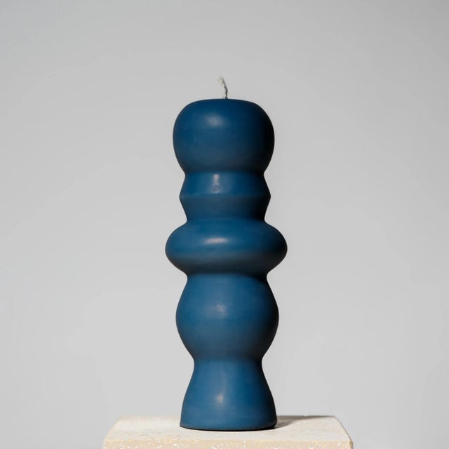Hand-poured sculptural pillar candle inspired by postmodern design, made with 100% USA beeswax and a cotton wick. This...