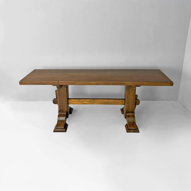Italian mid-century modern wooden dining table, 1970s Wood dining table with a large rectangular top and a structure...
