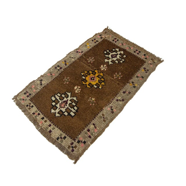 Vintage Handknotted decorative mini rug from Kars region of Turkey. Approximately 45-55 years old. In very good condition.